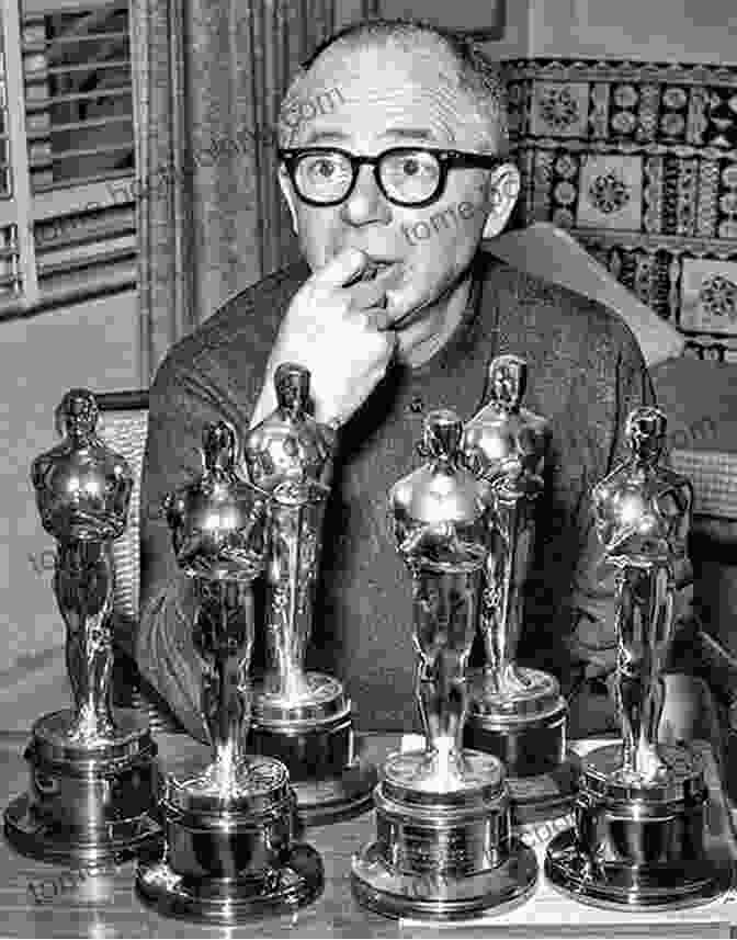 A Black And White Photograph Of Billy Wilder Holding Two Academy Awards, One For Best Director And One For Best Adapted Screenplay, With A Wide Smile On His Face. On Sunset Boulevard: The Life And Times Of Billy Wilder