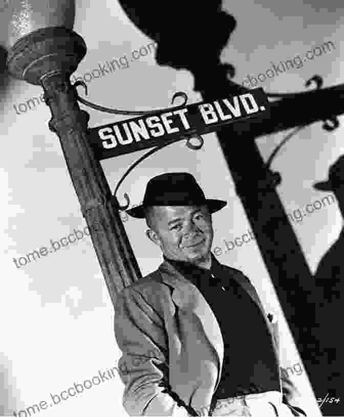 A Black And White Portrait Of Billy Wilder, A Man With A Gentle Smile And Piercing Eyes, Wearing A Suit And Tie. On Sunset Boulevard: The Life And Times Of Billy Wilder