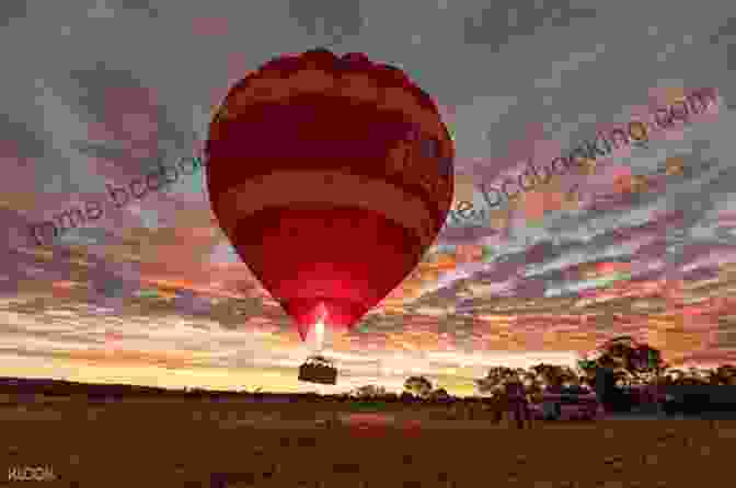 A Hot Air Balloon Floating Over The Outback, Offering Panoramic Views Of The Desert Landscape Alice Springs (The City Series)