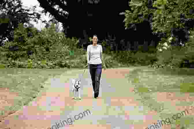 A Woman Walking Her Dog In A Park Being The Change: Live Well And Spark A Climate Revolution